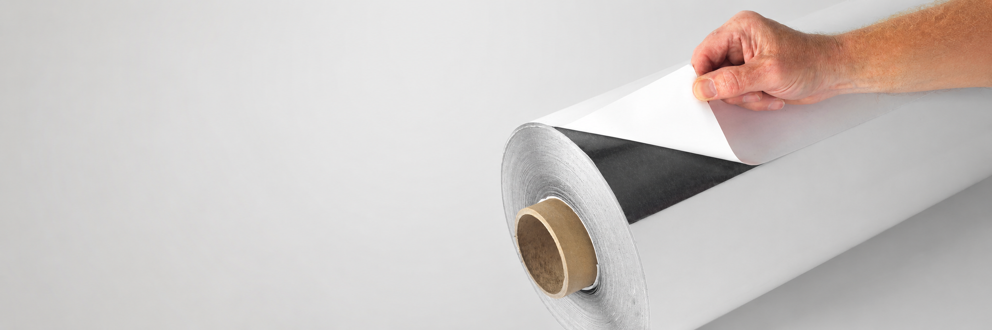 Self-adhesive flexible magnetic sheet roll for trade print, signage and POS applications