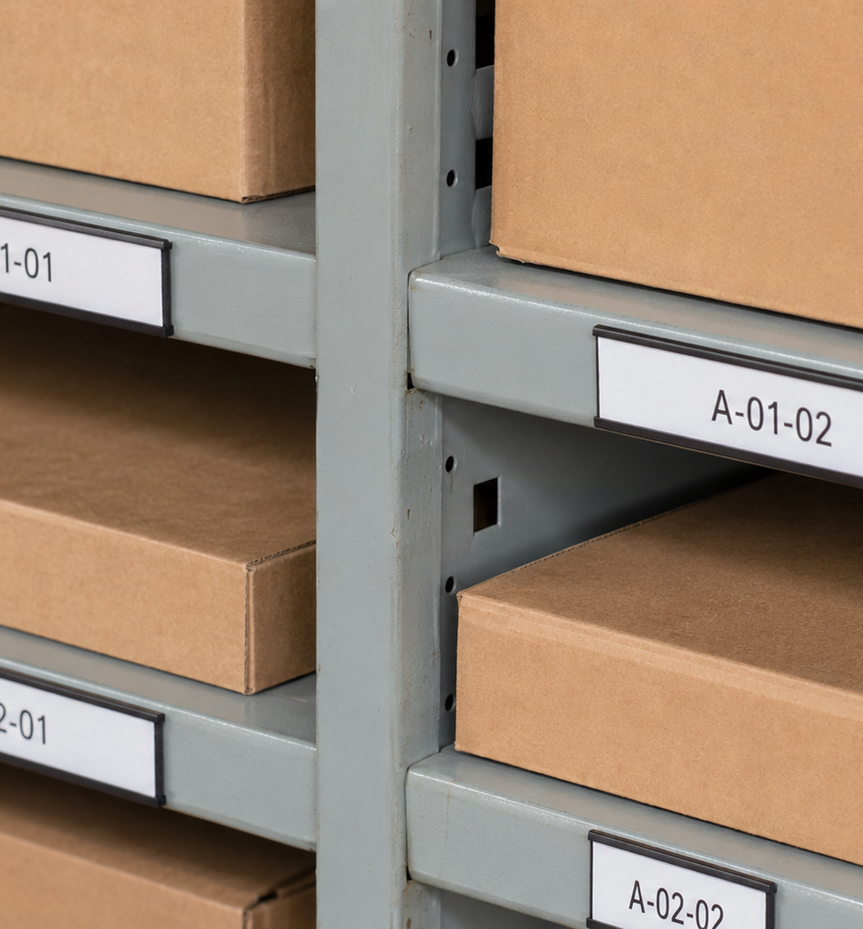 Warehouse shelving with magnetic C profile label holders used for changeable racking and stock location identification.
