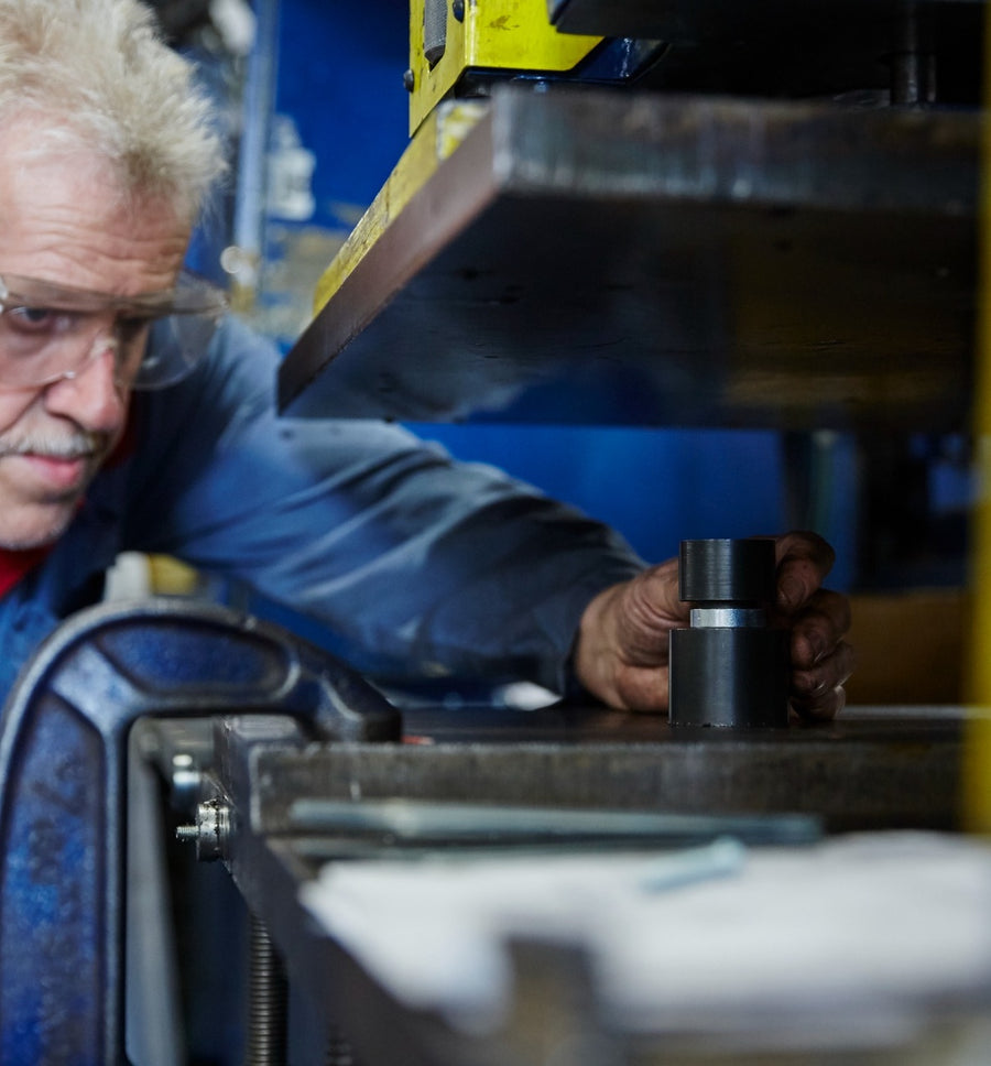 Engineer reviewing a custom magnetic component in Anchor Magnets’ workshop